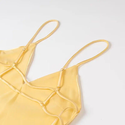 Yellow dress with a V-neck and thin straps, elegant, long, loose-fitting, sleeveless dress, 2025 style, for parties and special occasions.